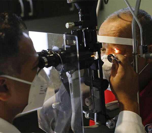 Dr. Deepan performing eye check up
