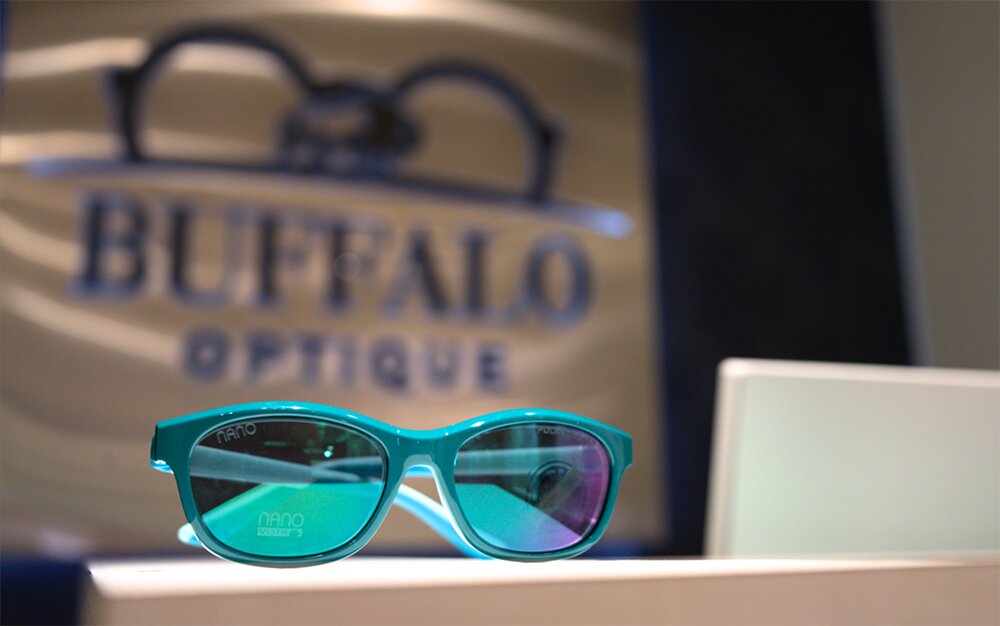 Color teal frame glasses at Buffalo Optique